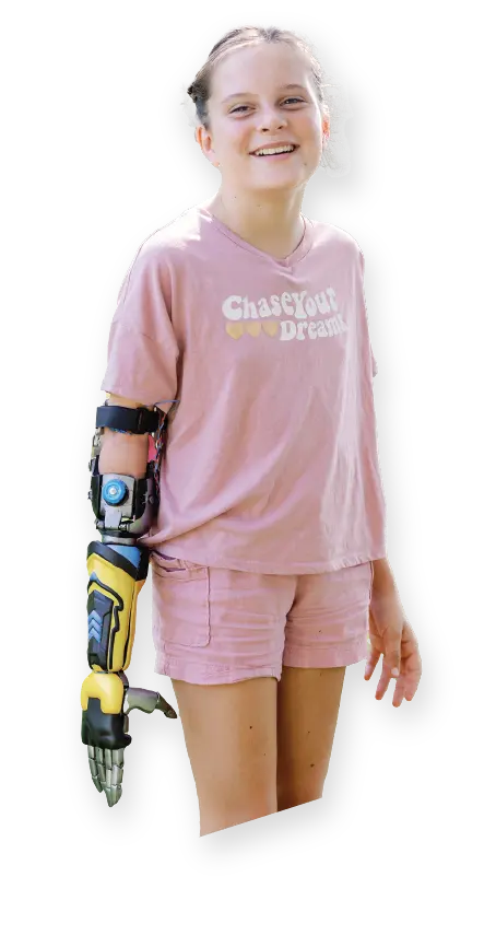 A Bionic Kid showing off their arm among colorful shapes and designs